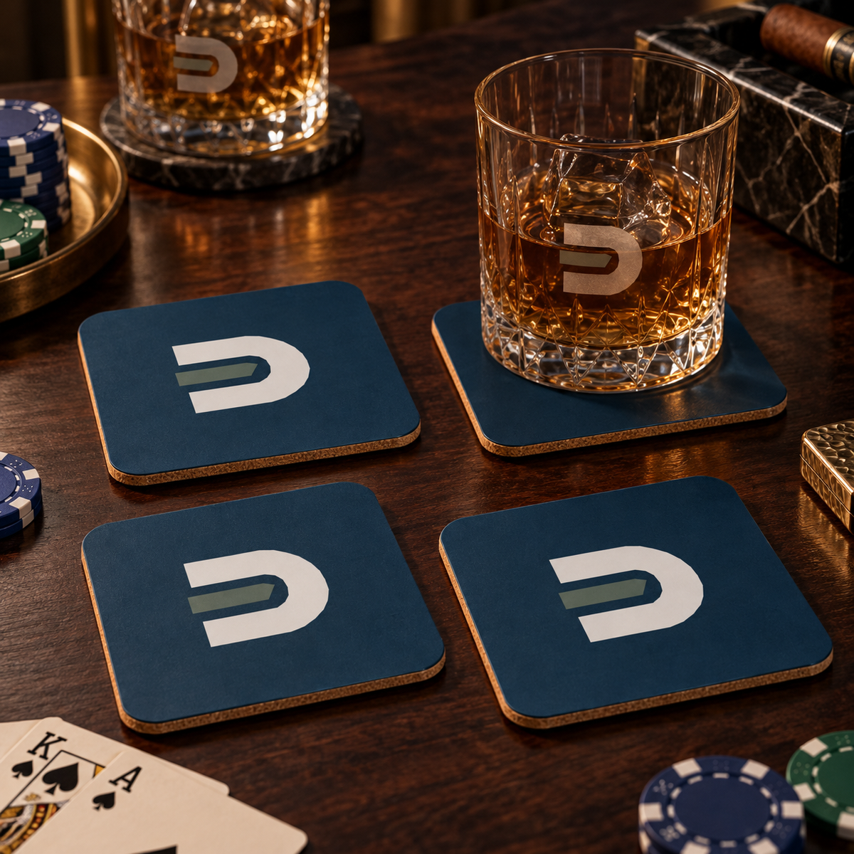 Four navy Dads in the Game D emblem coasters with rocks glasses and poker chips on a wooden table