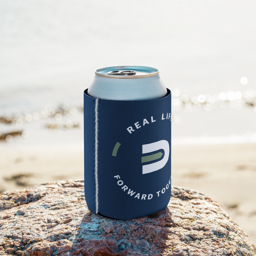 Navy Dads in the Game wheel can cooler on rocks beside water