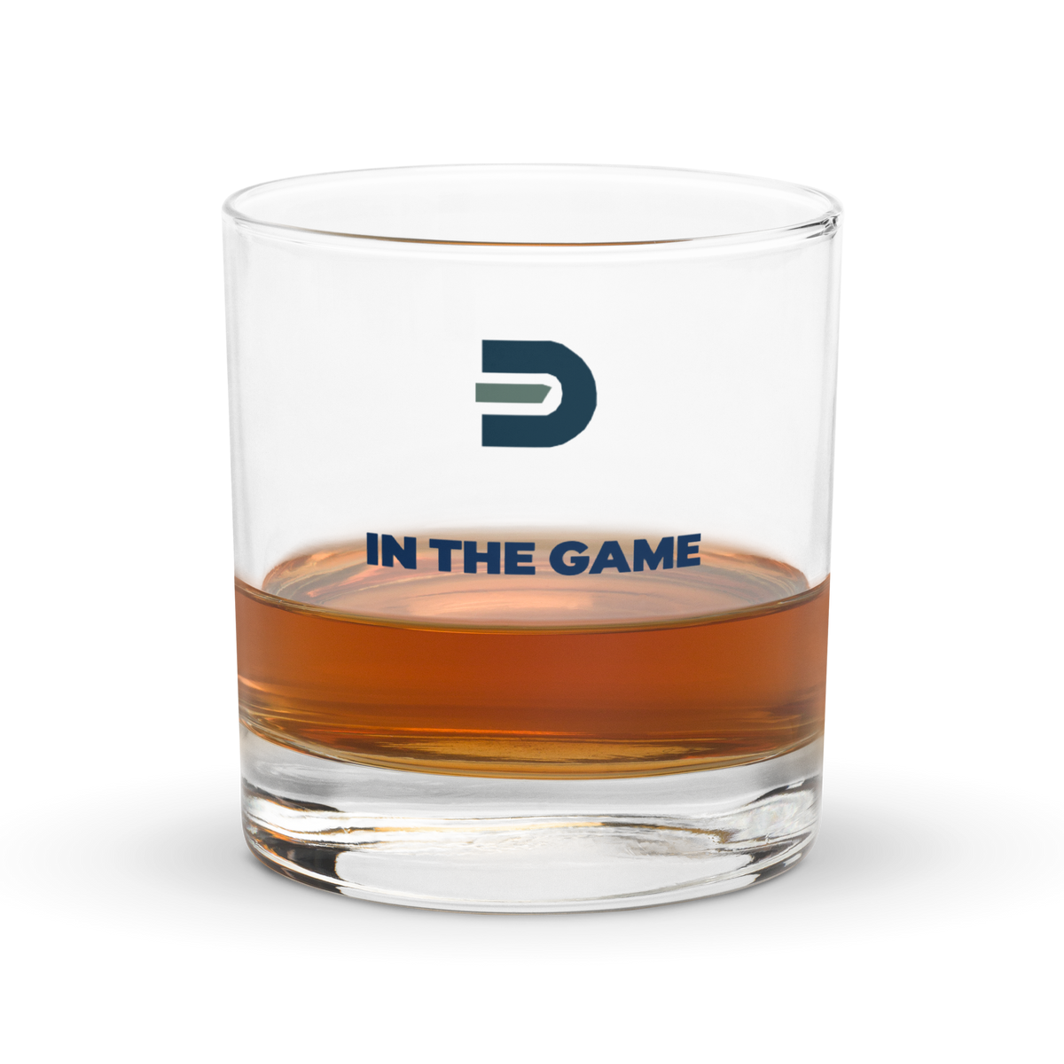 Dads in the Game rocks glass with D emblem and In the Game lettering, partly filled with an amber drink
