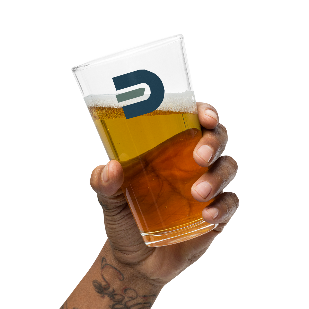 Hand holding a filled Dads in the Game Signature pint glass with the D emblem facing forward
