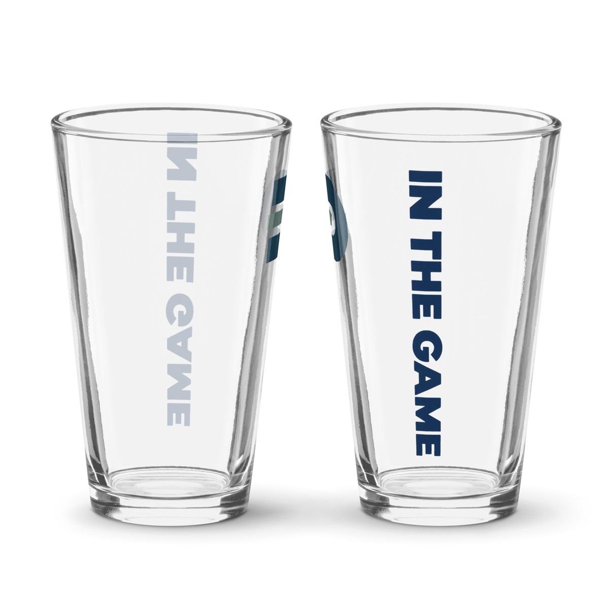 Two views of the Dads in the Game pint glass showing the D emblem and vertical In the Game lettering