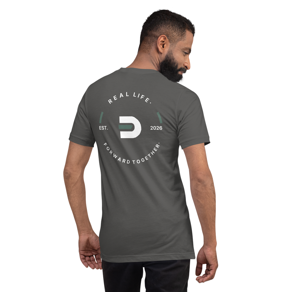 Model wearing the asphalt Dads in the Game Real Life Wheel T-shirt, back view showing the large Real Life, Forward Together wheel design